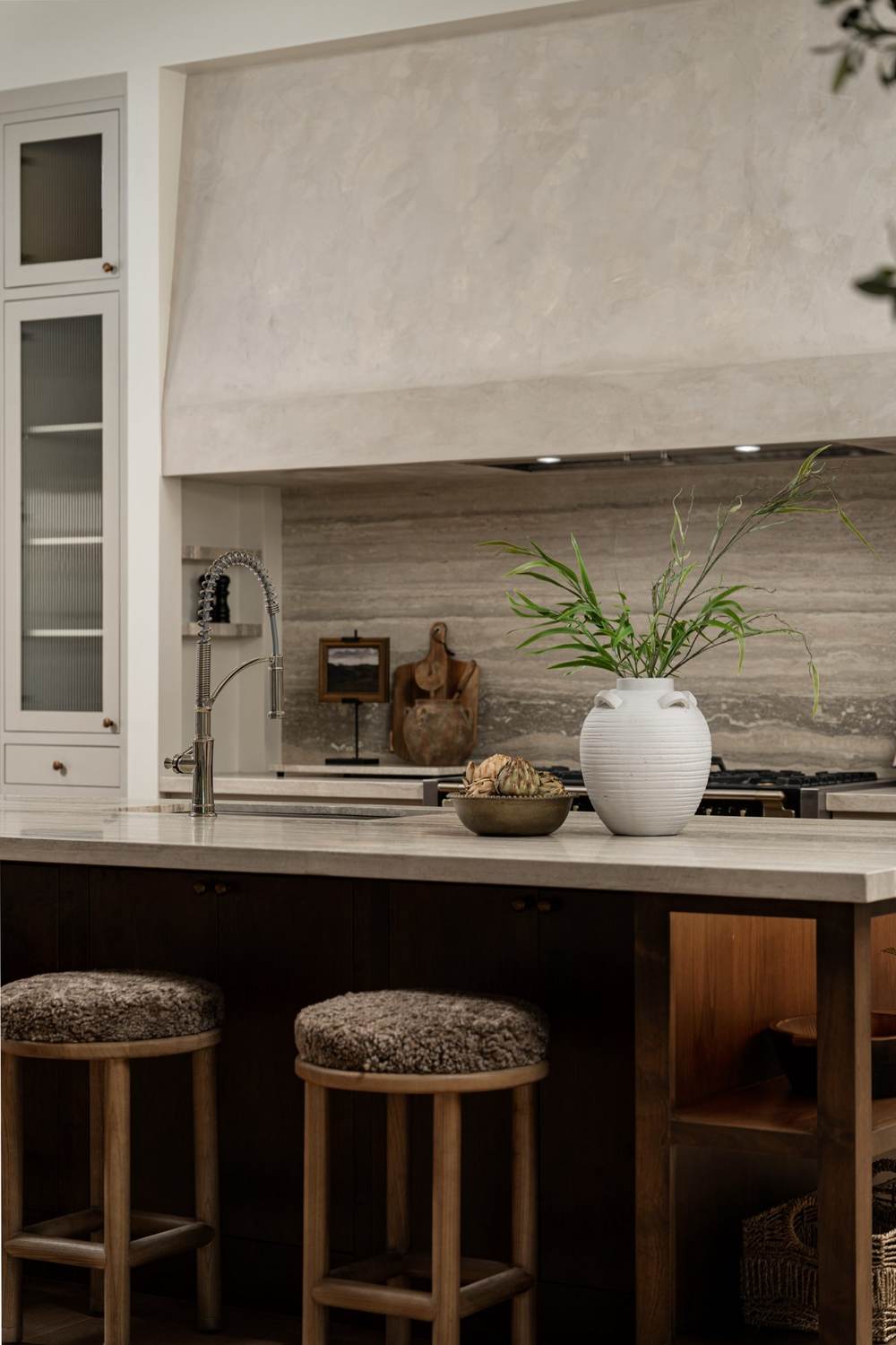 Plaster hood & natural stone backsplash