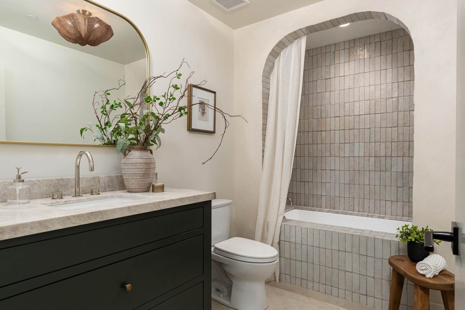 Zellige tile vanity & stone walk-in shower